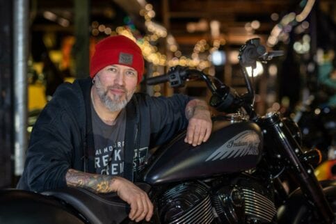 Ola Stenegard, Design Director for Indian Motorcycles leans on a new Chief model