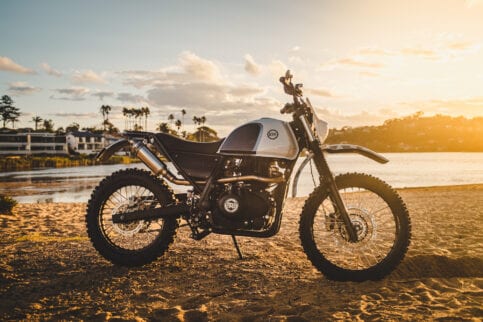 Schlachtwerk's Royal Enfield Himalayan Enduro Custom on a beach at sunset in Sydney